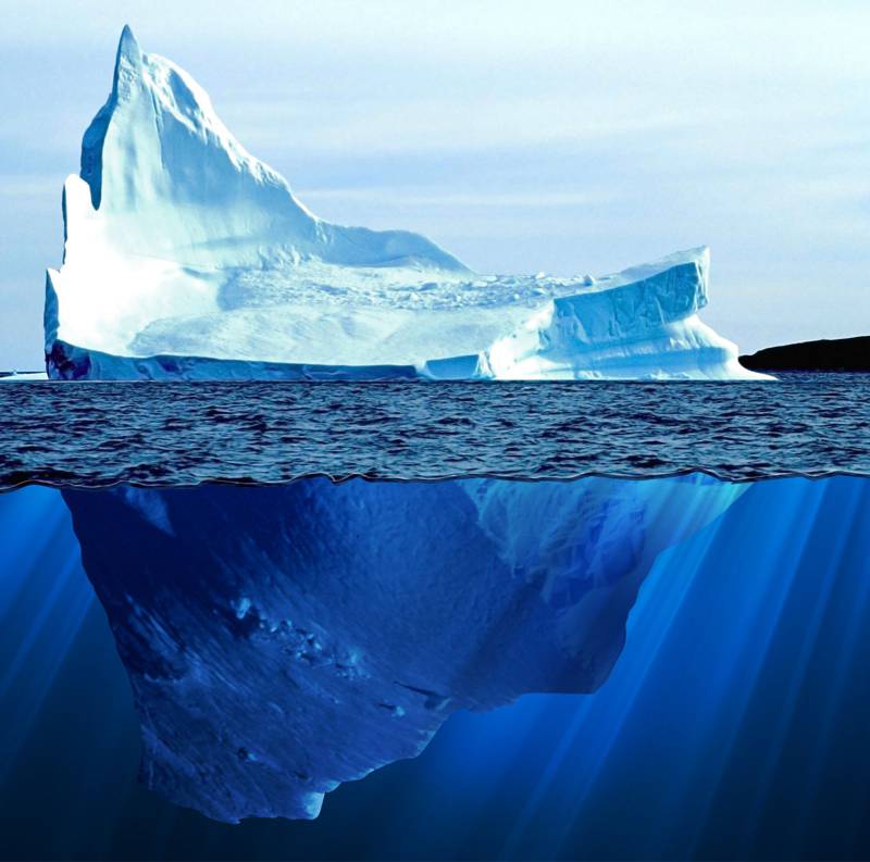 ice berg with huge portion beneath the water line